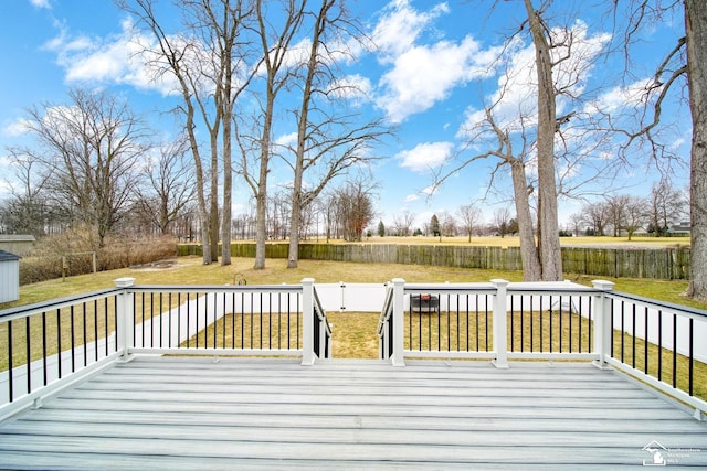 wooden terrace with a lawn