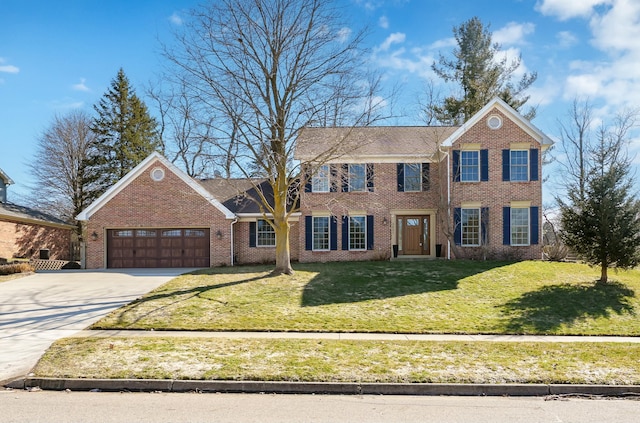 view of front of home featuring concrete driveway, brick siding, a garage, and a front yard