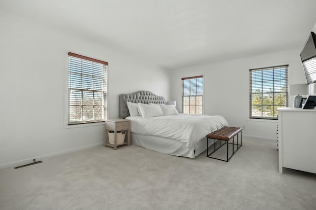 bedroom featuring baseboards, visible vents, and carpet floors