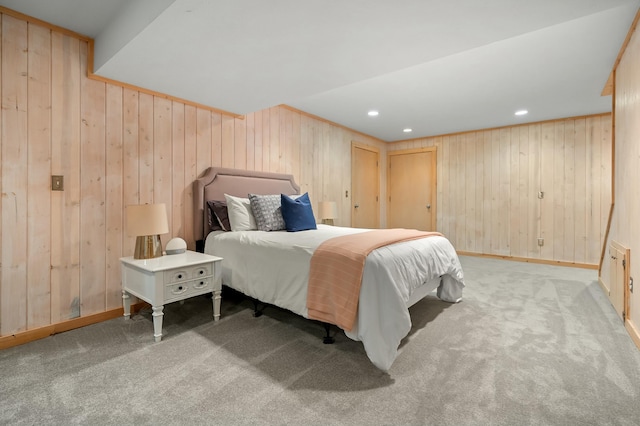 carpeted bedroom featuring recessed lighting, wood walls, and baseboards