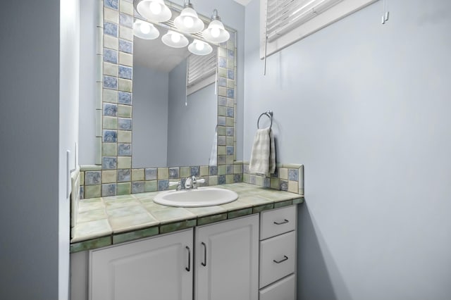 bathroom featuring decorative backsplash and vanity