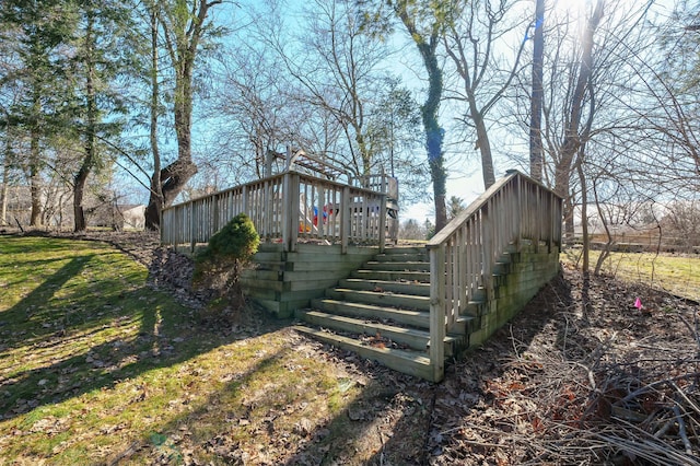 view of yard featuring a wooden deck and stairway