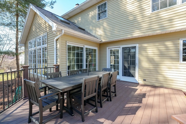 wooden terrace featuring outdoor dining area