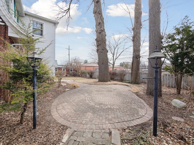 view of yard with a patio and fence