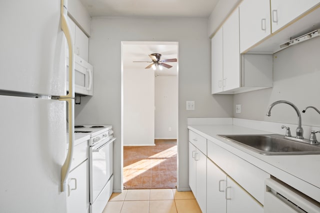 kitchen with ceiling fan, light colored carpet, white cabinets, white appliances, and a sink