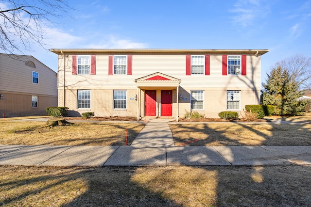 view of front of house with brick siding