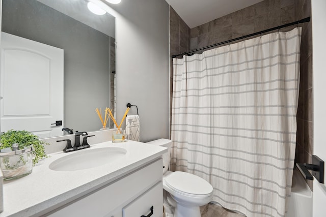 bathroom featuring vanity, toilet, and shower / tub combo with curtain