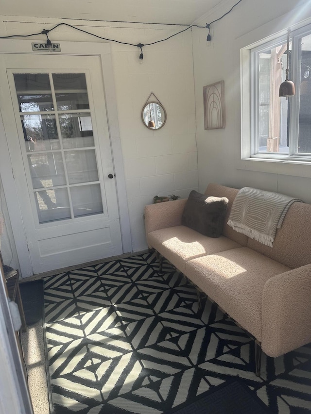 interior space with concrete block wall