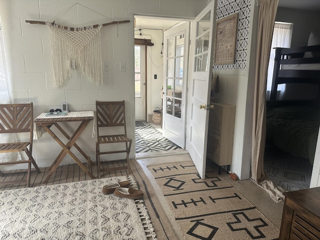 interior space with concrete block wall