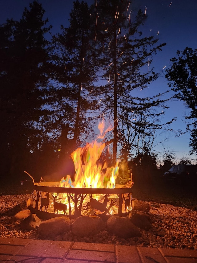 view of property's community with an outdoor fire pit