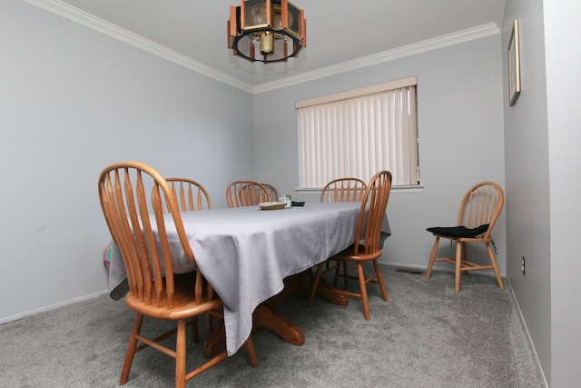 dining area featuring baseboards, carpet, a chandelier, and crown molding