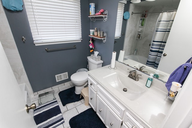 full bath with visible vents, toilet, curtained shower, tile patterned flooring, and vanity