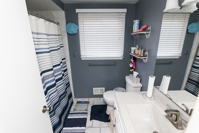 bathroom with tile patterned floors, visible vents, toilet, a shower with shower curtain, and vanity