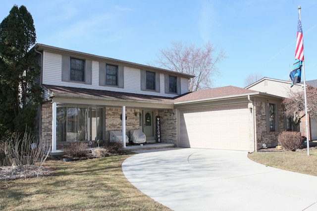 traditional home featuring driveway, a front lawn, covered porch, an attached garage, and brick siding