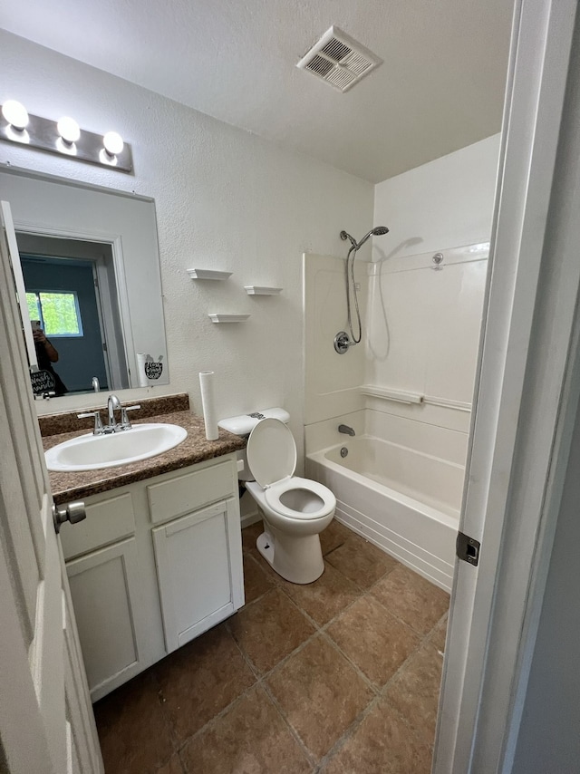 bathroom with tile patterned flooring, visible vents, toilet, vanity, and  shower combination