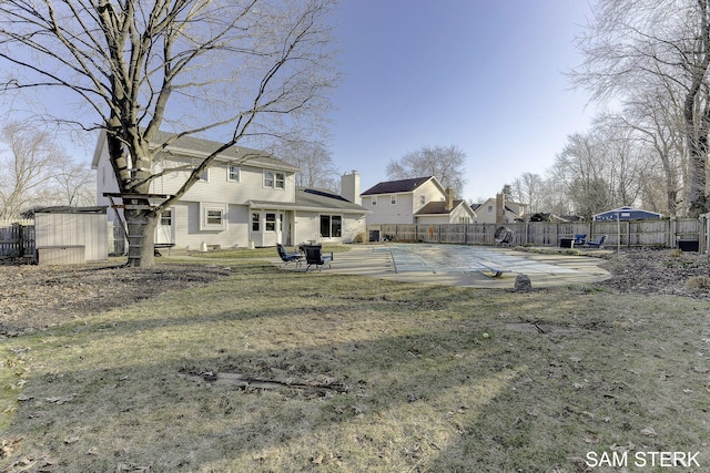 view of yard with a fenced backyard and a patio area