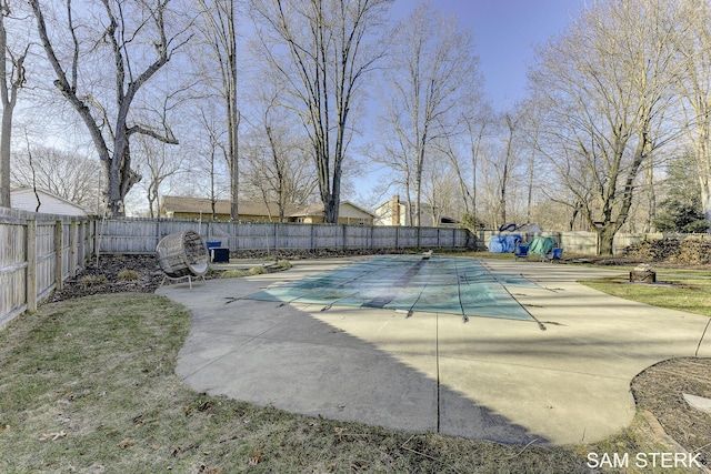 view of swimming pool with a fenced in pool, a patio, and a fenced backyard