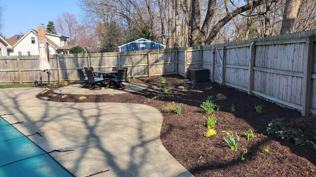 view of yard with a fenced backyard and a patio