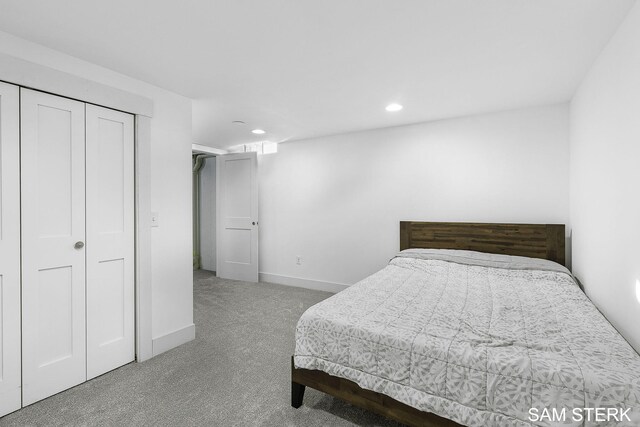 bedroom with recessed lighting, a closet, baseboards, and carpet