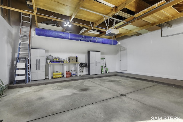 garage featuring a garage door opener and fridge