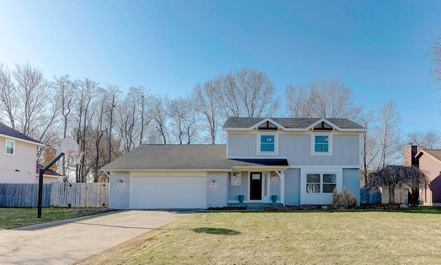 traditional-style home with board and batten siding, fence, concrete driveway, a front yard, and a garage