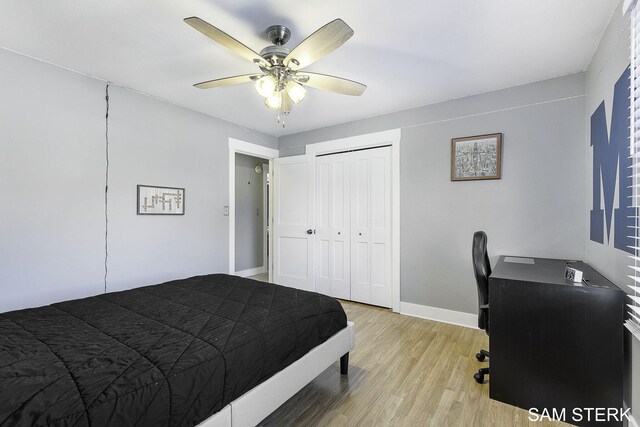 bedroom featuring a closet, light wood-style flooring, baseboards, and ceiling fan