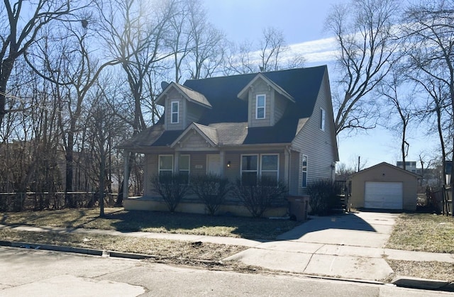 view of front of house featuring fence, covered porch, a garage, an outdoor structure, and driveway