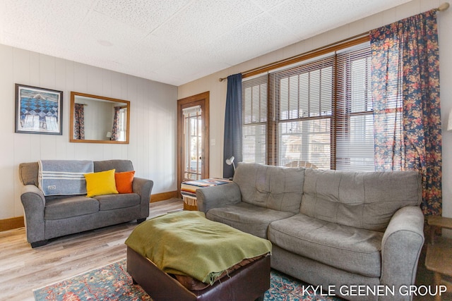 living room with wood finished floors and baseboards