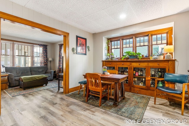 dining area featuring baseboards and wood finished floors