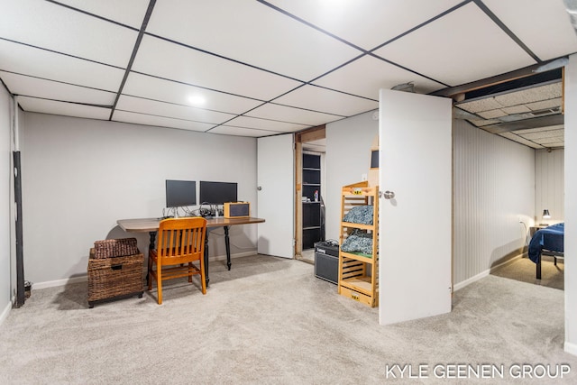 home office featuring a drop ceiling and carpet