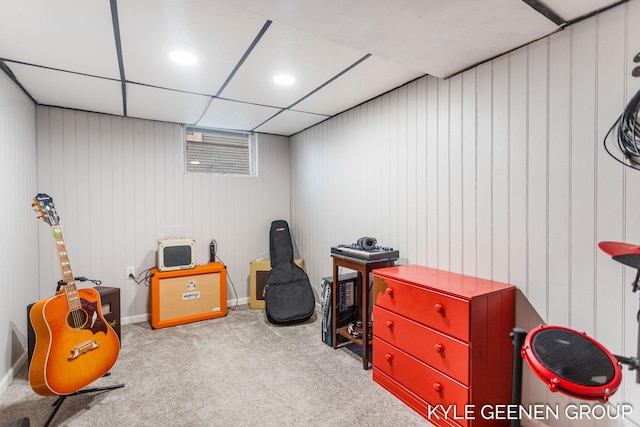 playroom with carpet flooring and a paneled ceiling