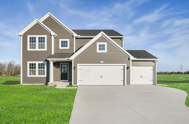 view of front of house with driveway, a front lawn, and a shingled roof