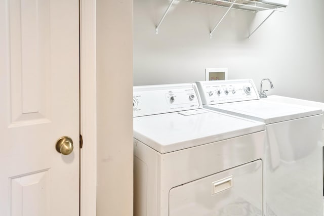 laundry area with washer and dryer and laundry area