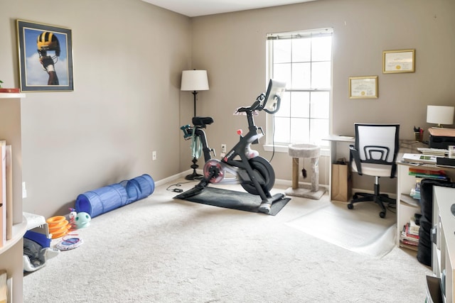 workout room with carpet flooring and baseboards