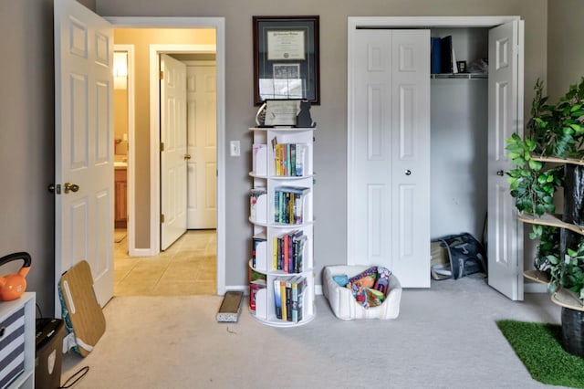 interior space with tile patterned floors and carpet