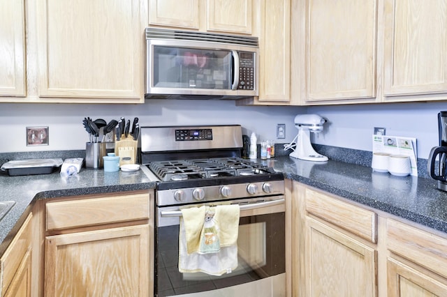 kitchen featuring appliances with stainless steel finishes and light brown cabinets