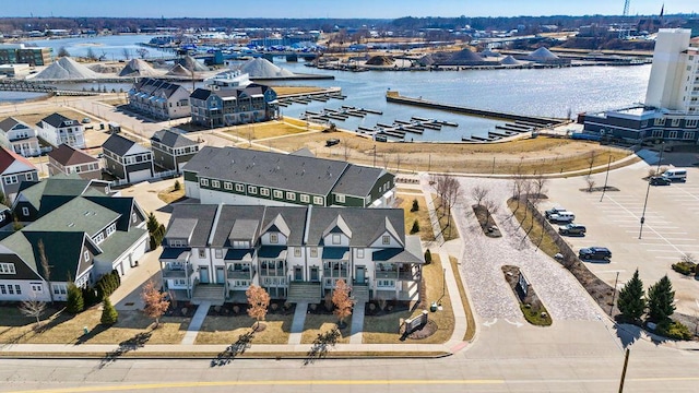 birds eye view of property with a residential view and a water view