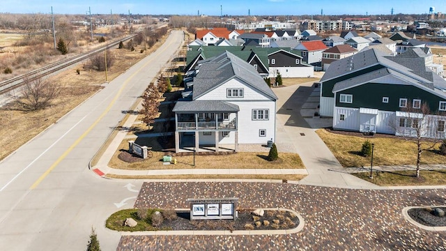 birds eye view of property with a residential view