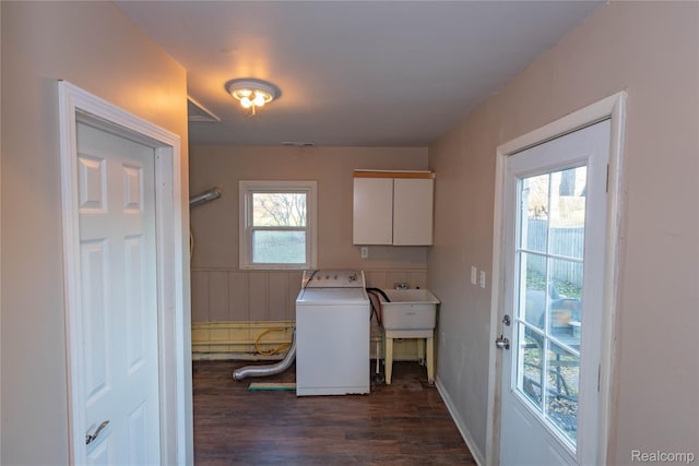 clothes washing area featuring visible vents, wainscoting, wood finished floors, cabinet space, and washer / clothes dryer