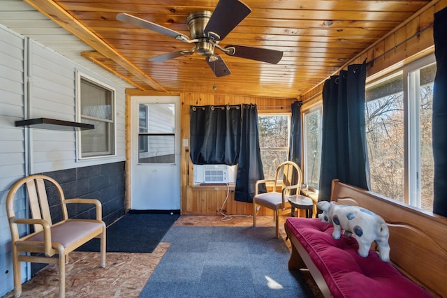 sunroom / solarium featuring cooling unit, wood ceiling, and ceiling fan