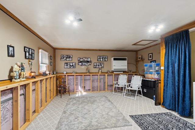 office space with attic access, crown molding, and carpet