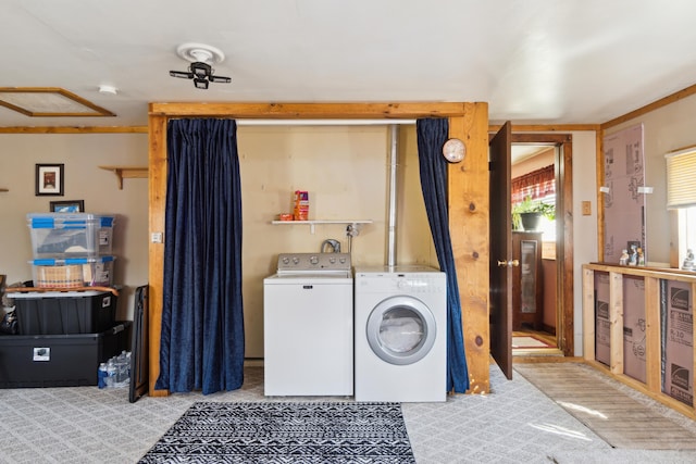 washroom featuring laundry area and washing machine and dryer