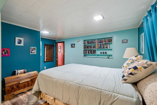 bedroom with wood finished floors