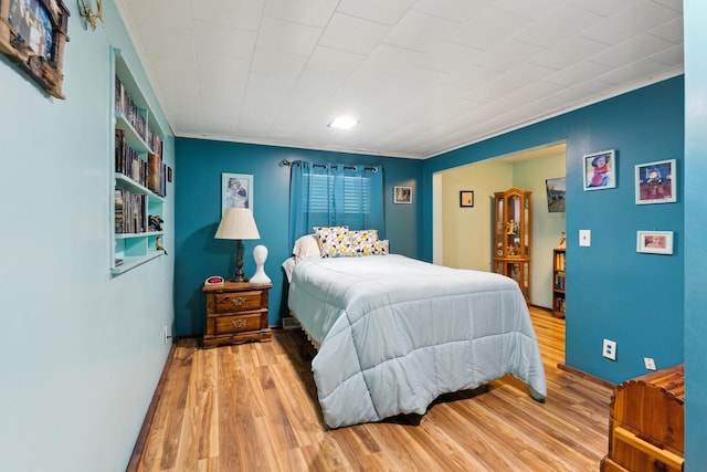 bedroom featuring wood finished floors