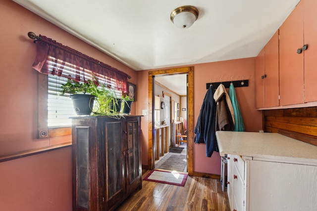 interior space with wood finished floors and baseboards