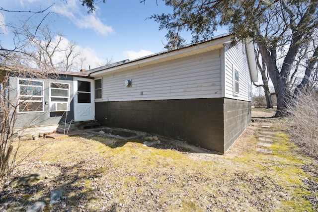 view of property exterior featuring entry steps