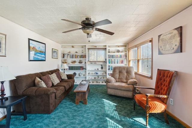 living room with carpet flooring, a ceiling fan, and baseboards