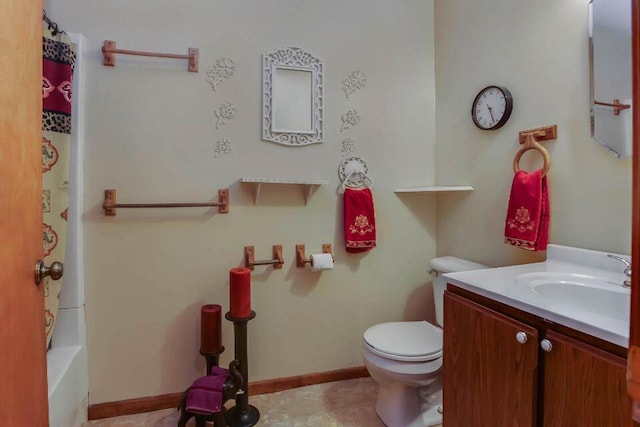 full bathroom featuring toilet, vanity, and baseboards