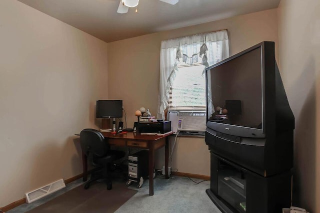 office featuring visible vents, baseboards, light carpet, and ceiling fan