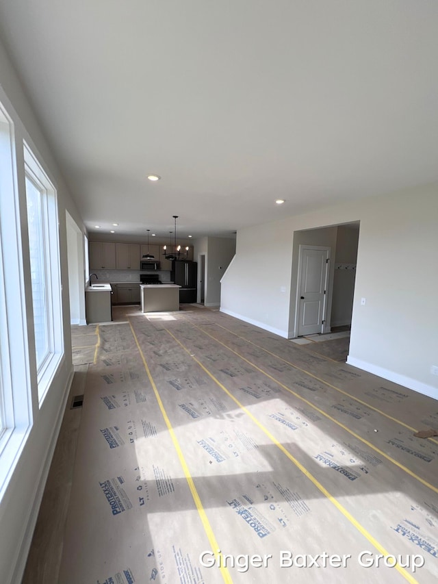 11328 Shoreline Dr Unit 118, Allendale, MI 49401 - unfurnished living room featuring recessed lighting and baseboards